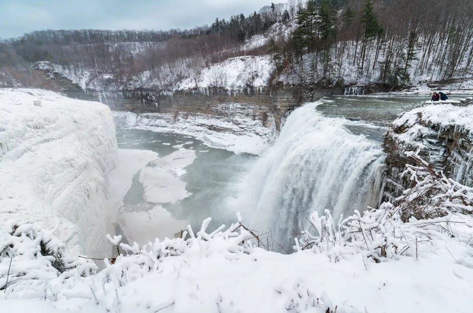 Tahquamenon Falls Winter Hiking Guide (2026) 1 Tahquamenon Falls winter hiking trail with massive frozen waterfall and ice formations