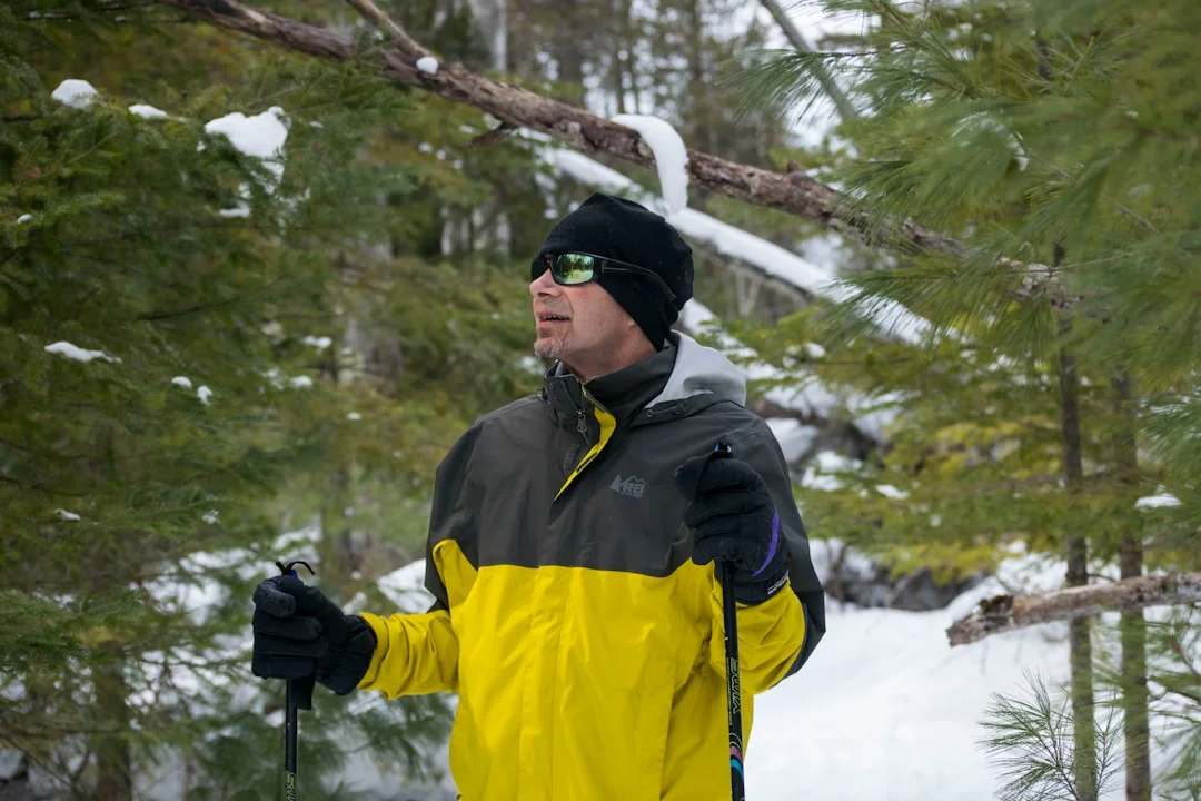 Hypothermia Prevention: What Every Hiker Needs to Know at Highline Trail 3 Hiker in winter jacket and knit cap demonstrating proper cold weather layering