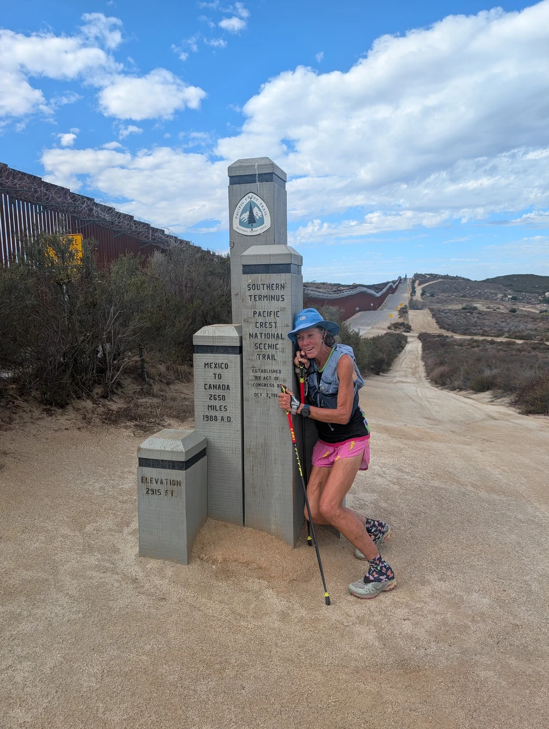 Snowshoe trail through winter forest with snow-covered trees