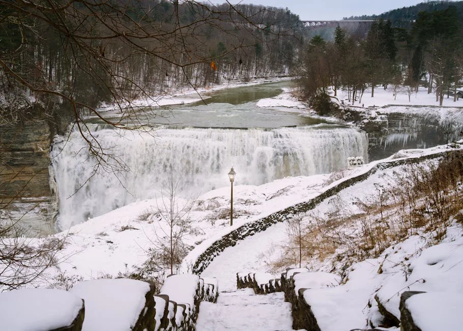 Matthiessen State Park winter hiking - frozen waterfall cascading down snow-covered canyon with icy trail steps