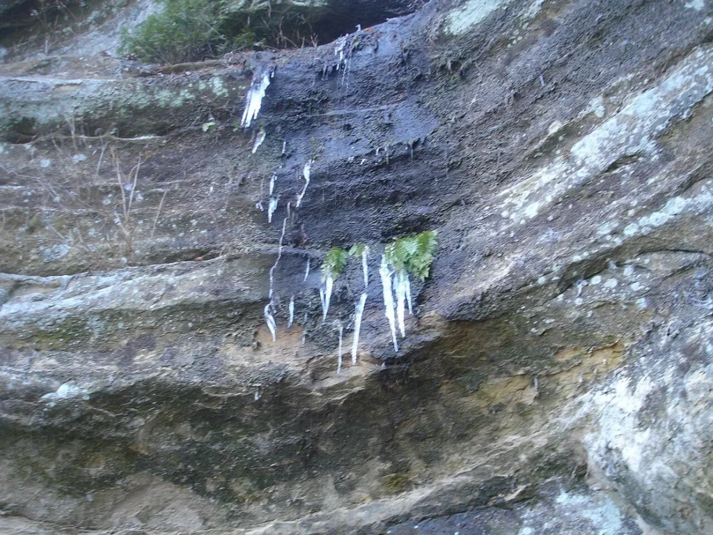 Starved Rock winter hiking frozen waterfalls - dramatic ice formations in canyon