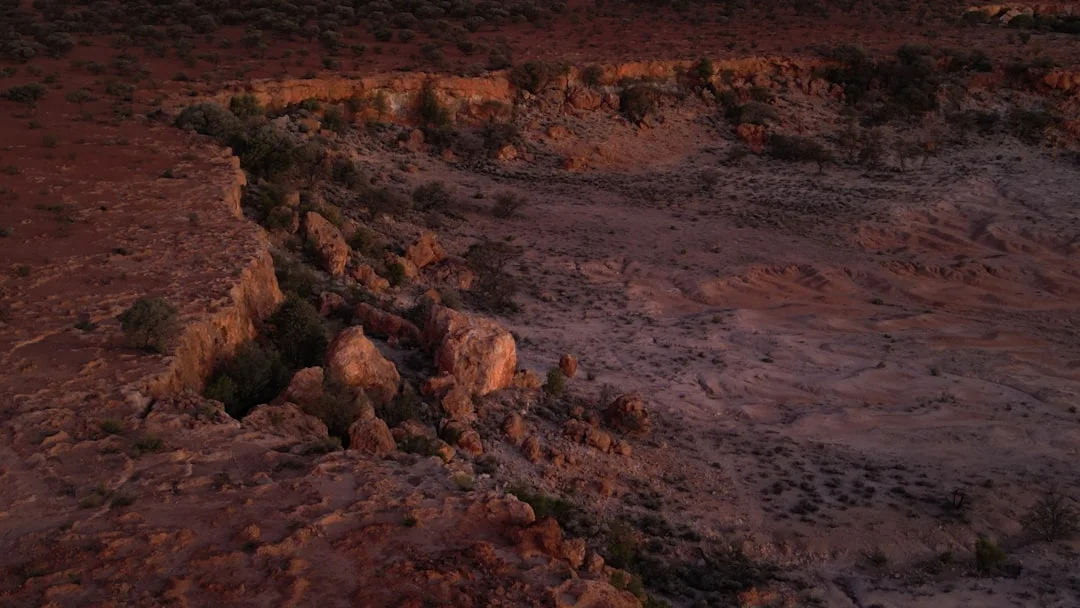 Red canyon walls bathed in warm twilight light at Flaming Gorge