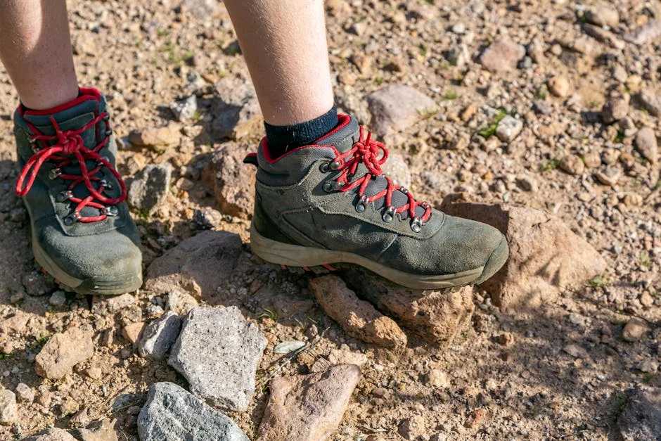 Winter Hiking Boot Review: Dry Tortugas (2026) 7 Hiking boots on rocky desert terrain close-up showing outsole grip on abrasive coral-like surface