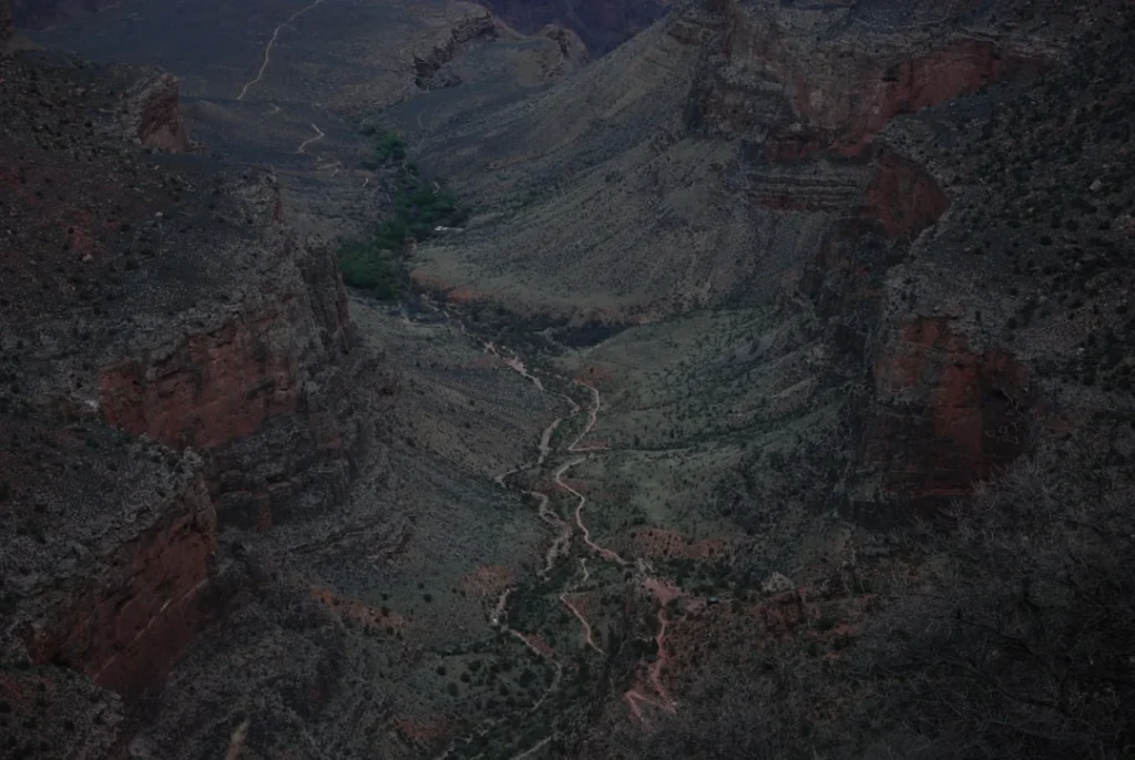 Rainy spring hike on Bright Angel Trail with aerial view of Grand Canyon canyon walls and layered rock formations