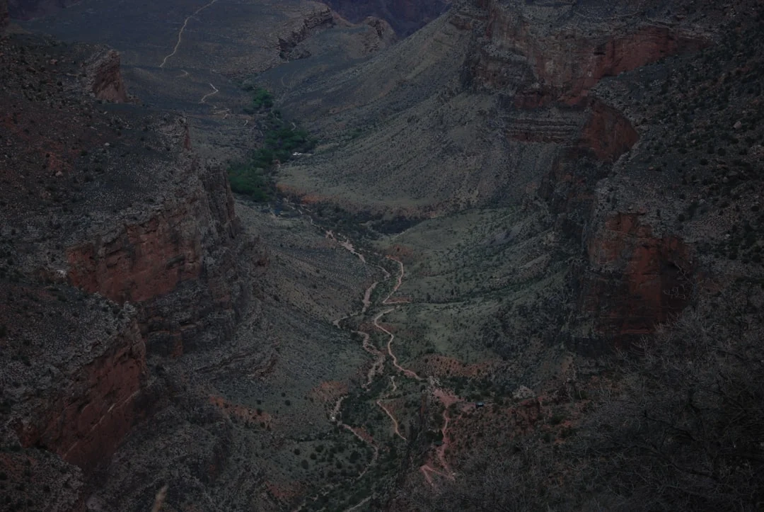 Rainy spring hike on Bright Angel Trail with aerial view of Grand Canyon canyon walls and layered rock formations